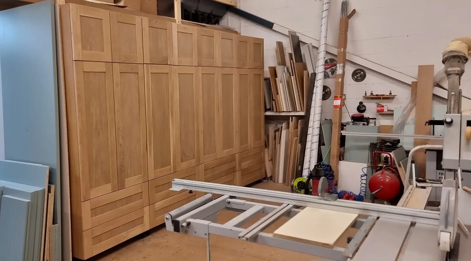 Shaker-style solid oak wardrobe doors assembled in the JS DECO workshop during the manufacturing stage.