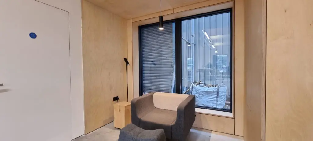 Bespoke plywood joinery fitted around the office architecture.