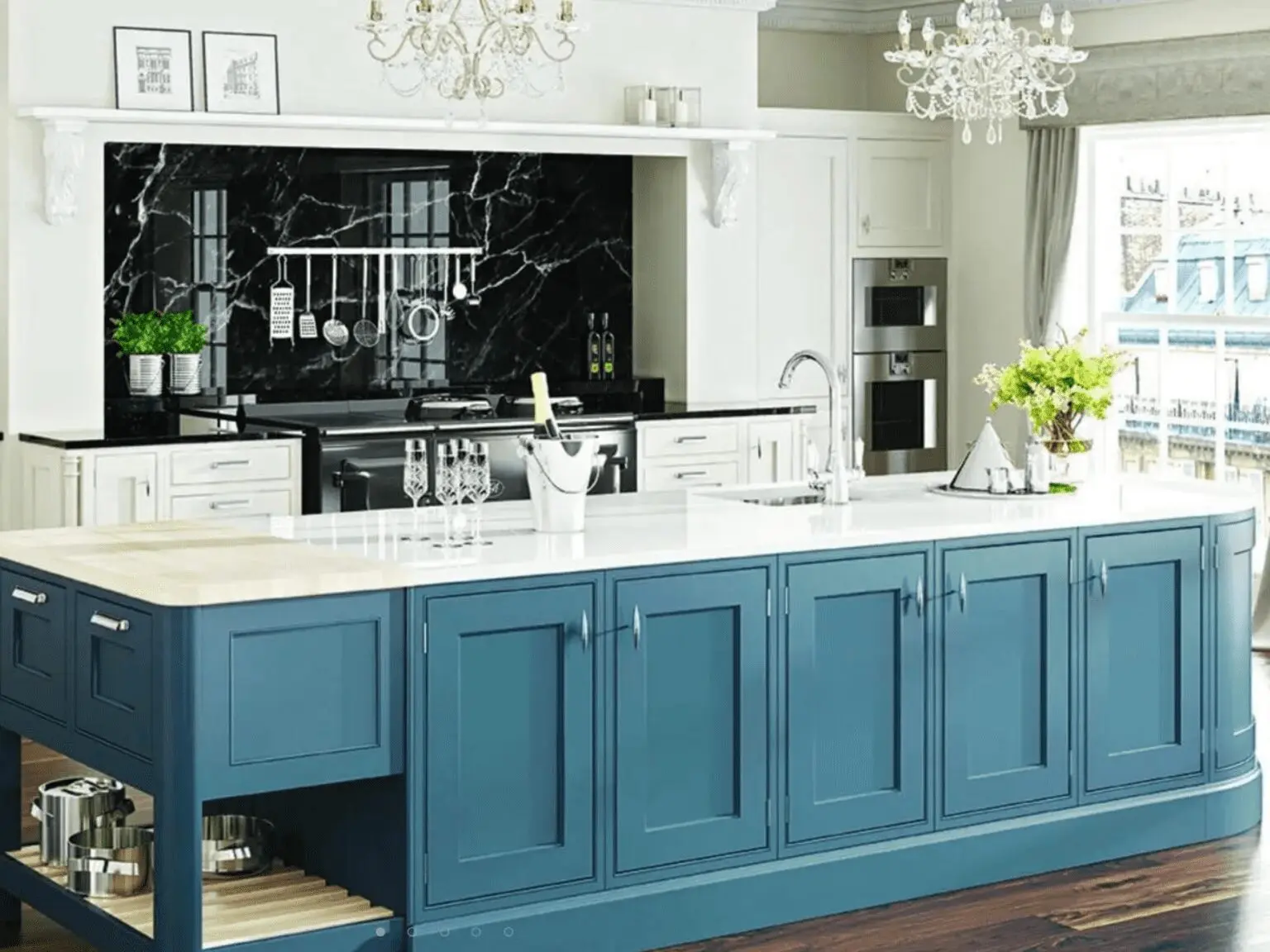 Painted in-frame kitchen with a curved blue island and pale cabinetry