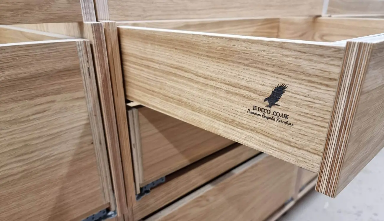 JS DECO bespoke plywood drawer boxes with exposed birch layers and premium dovetail-style construction.