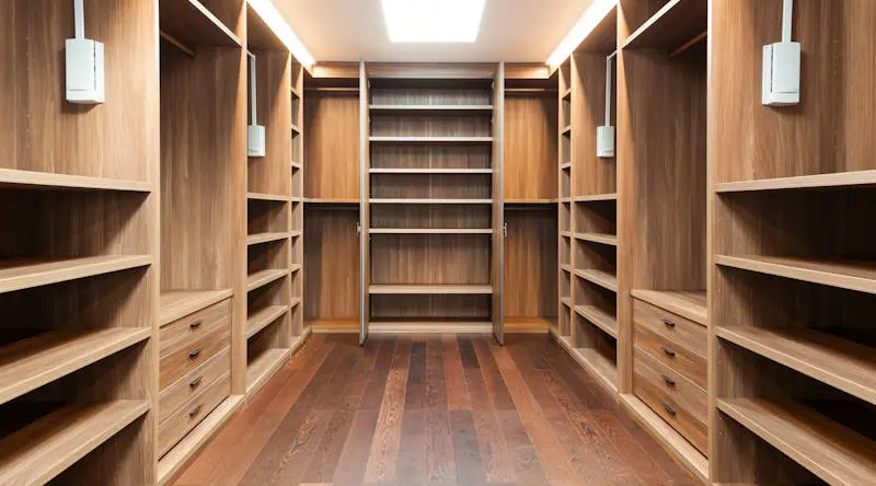 Custom-made fitted wardrobes with open plywood shelving and drawers, designed and manufactured by JS DECO in the UK.