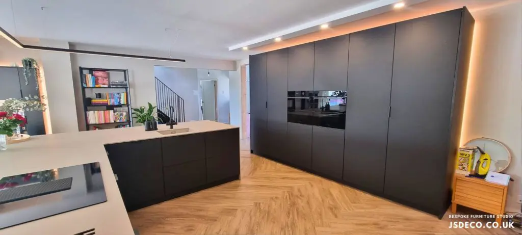Black FENIX tall cabinets with ovens and bifold doors