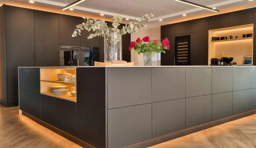 Black matt FENIX kitchen with a light worktop and island in Manchester