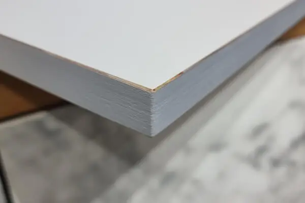 FENIX NTM plywood-core door panel with painted edge and white ultra-matt surface.