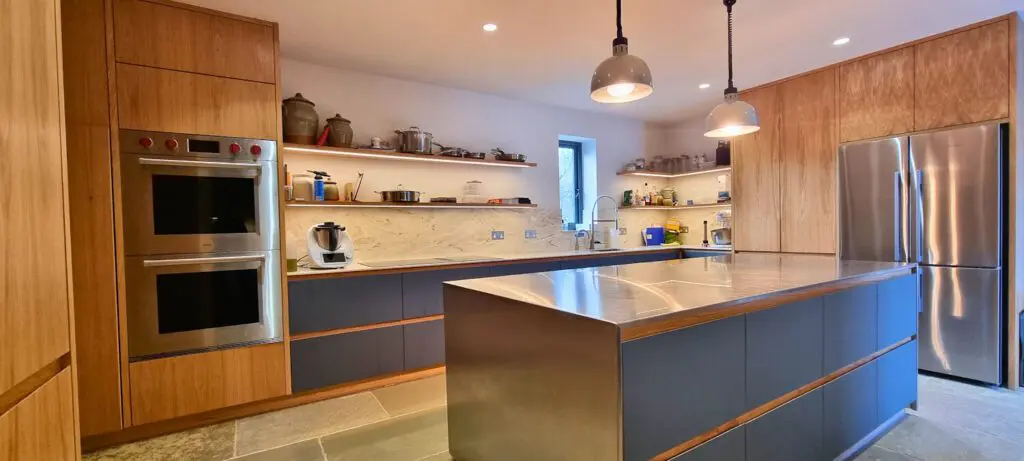 The island sits between oak appliance housing and the perimeter work surfaces