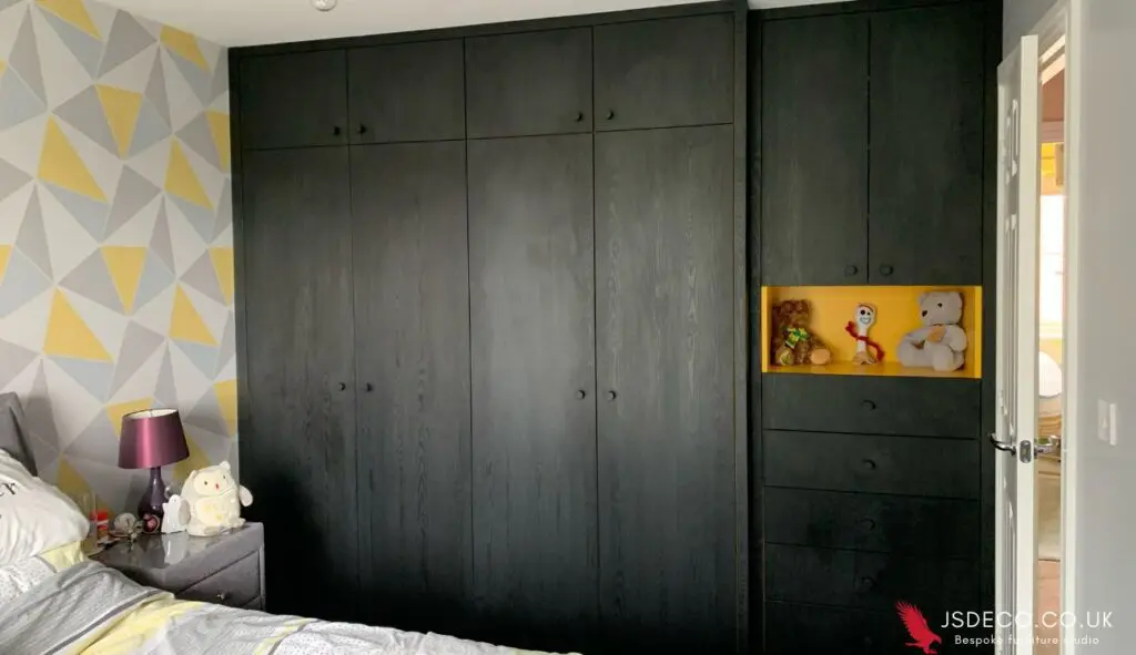 Full height black matte bespoke fitted wardrobe installed in modern UK bedroom