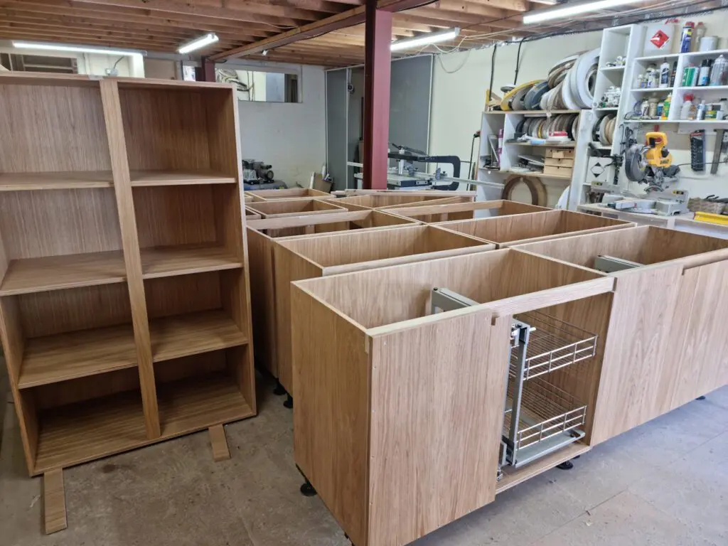 Tall and base cabinet assemblies at the workshop stage