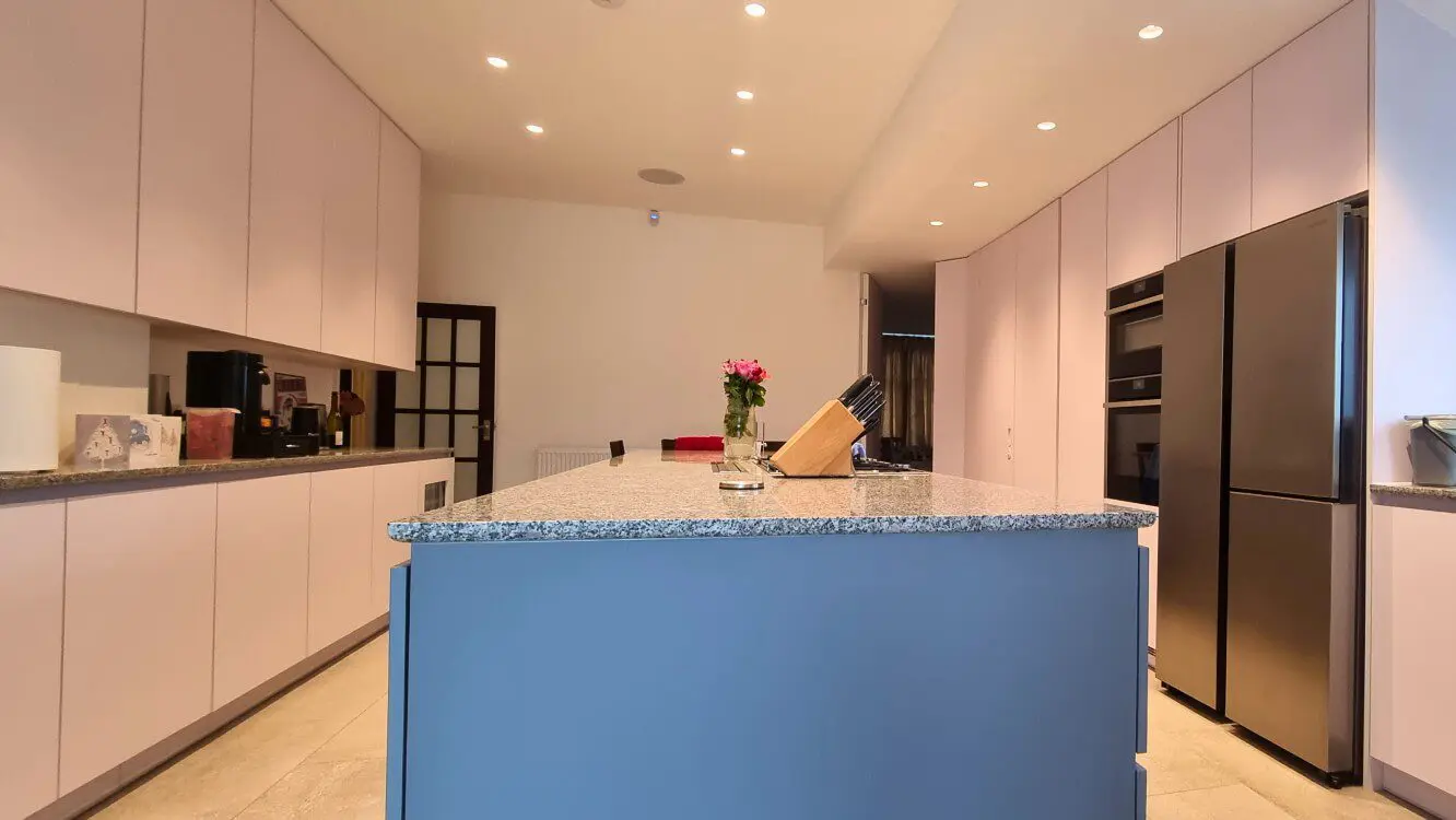 Large modern FENIX kitchen with grey island Large modern FENIX kitchen with grey island and white handleless cabinets