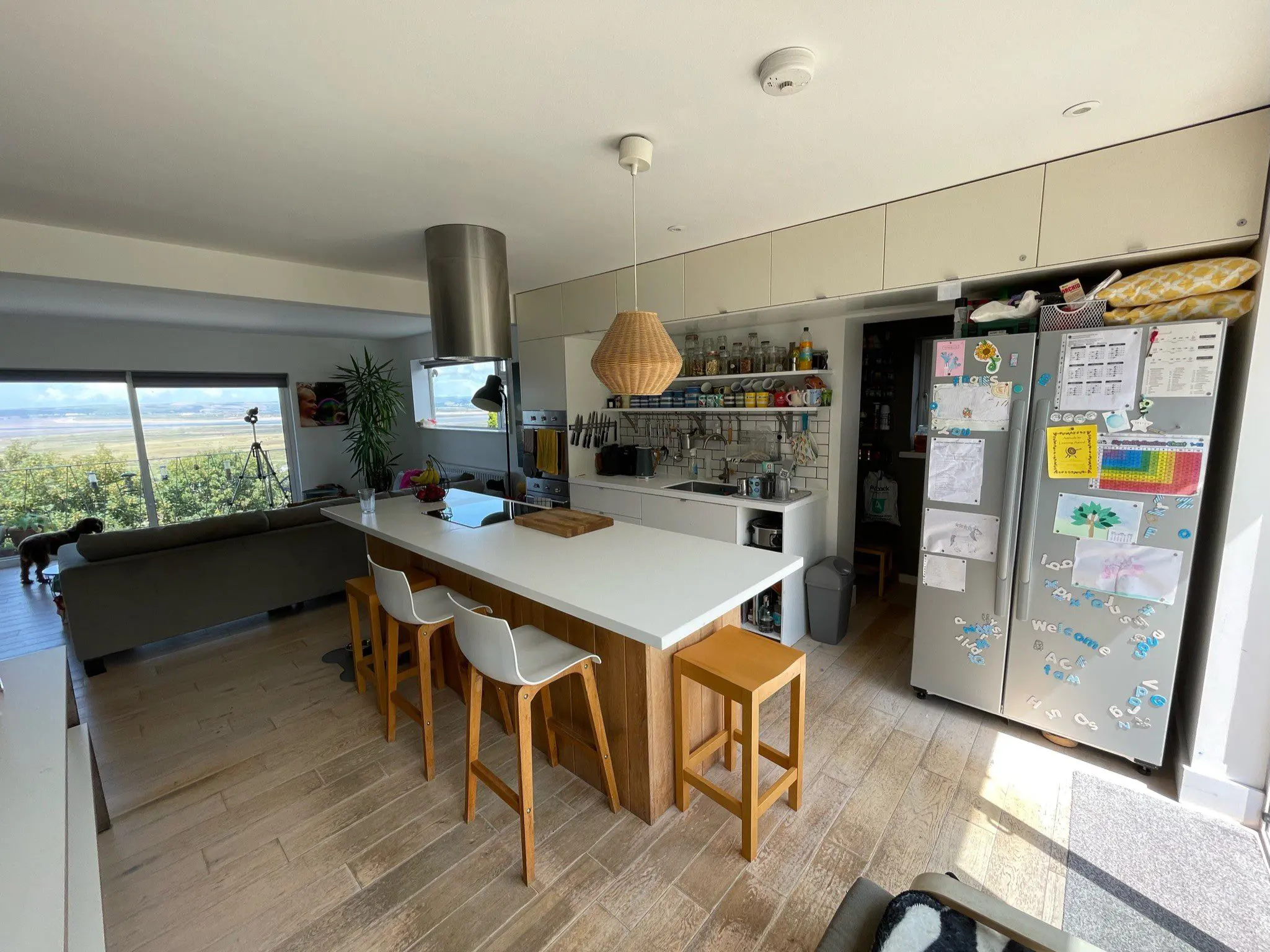 Original kitchen with island and dining area before Scandinavian minimalist kitchen renovation near Bristol