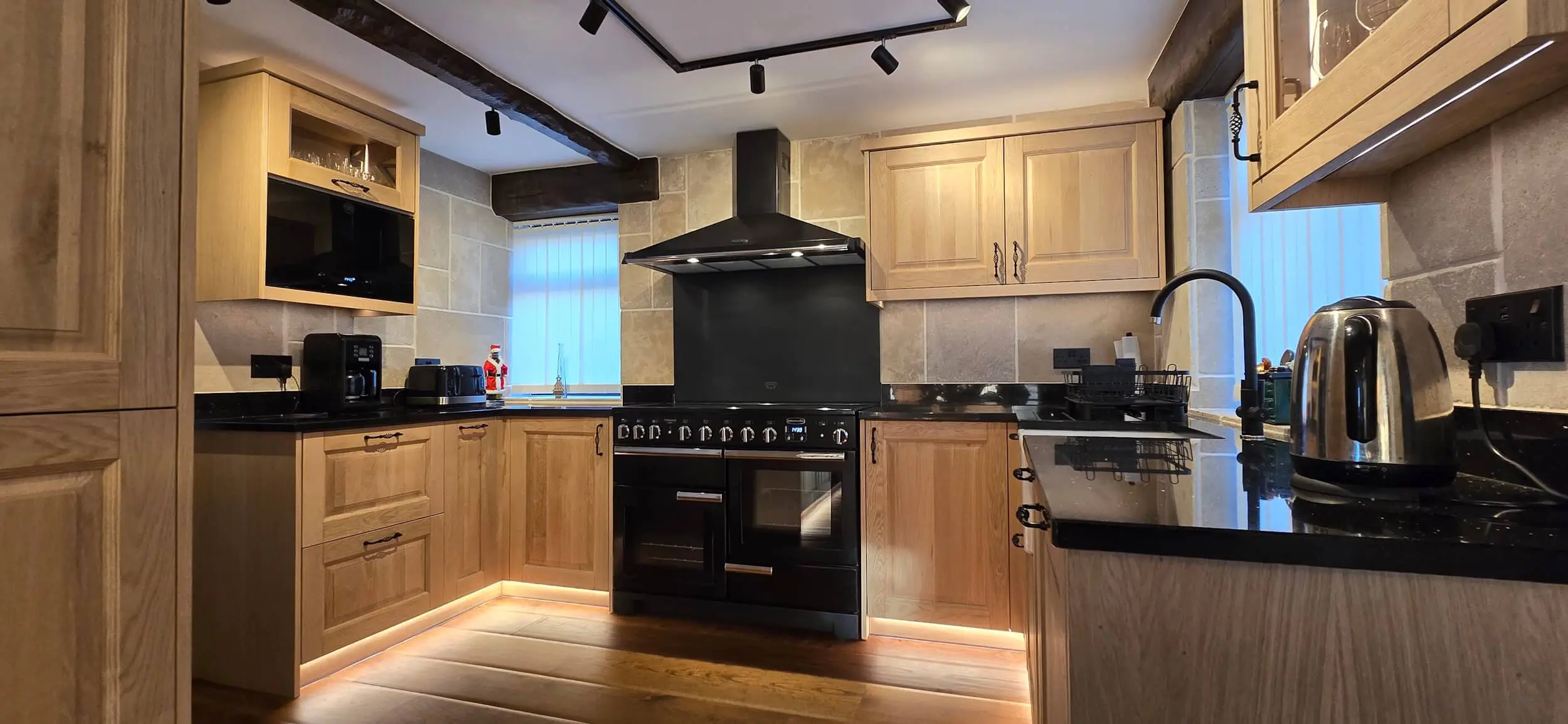 Hand made solid oak luxury kitchen with ogee door profiles and granite worktops in Huddersfield home