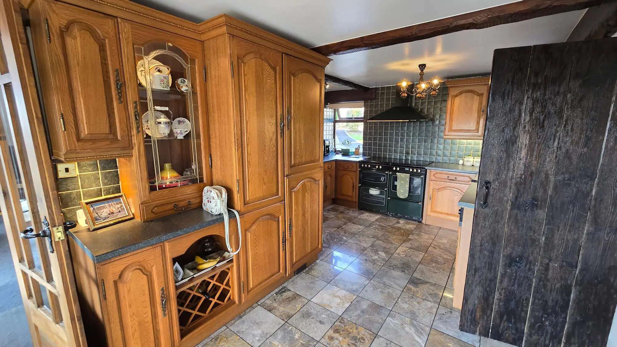 Original oak kitchen storage with cathedral doors before hand made renovation in Huddersfield