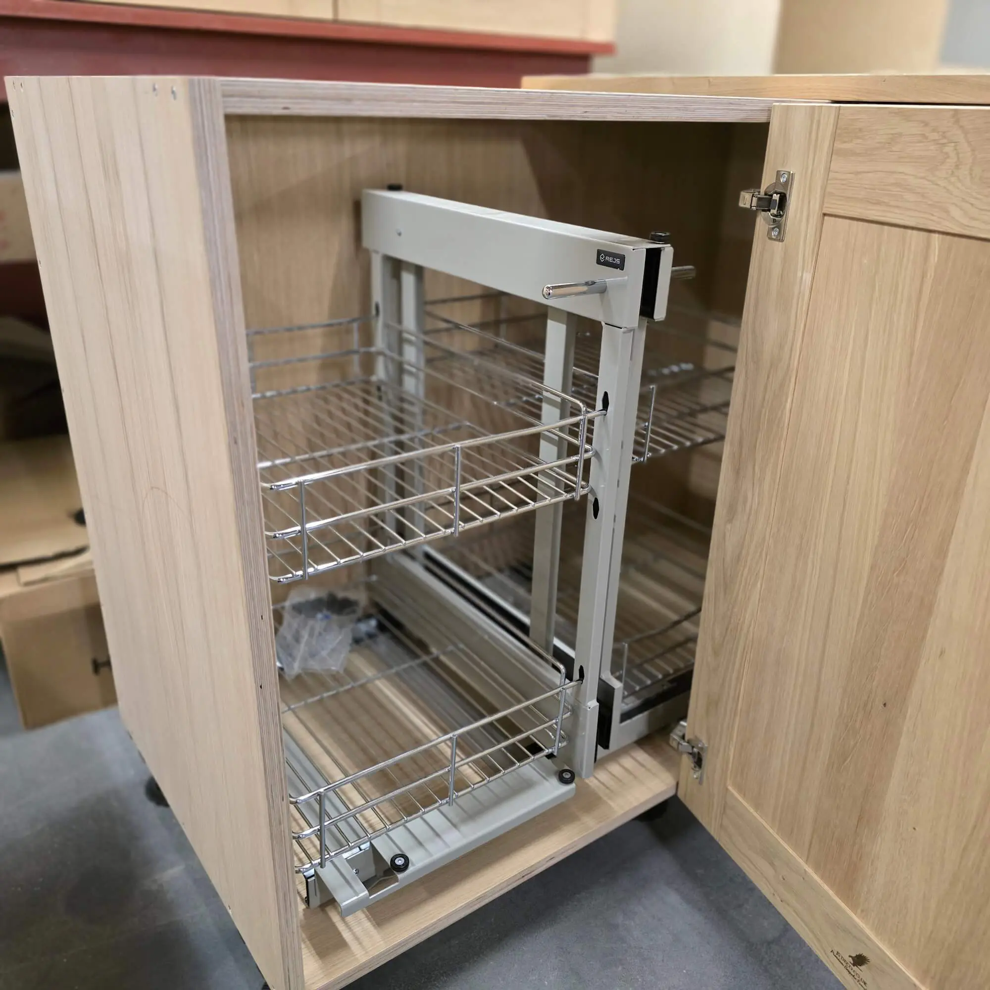 Rejs pull-out storage system installed in hand made solid oak kitchen cabinet