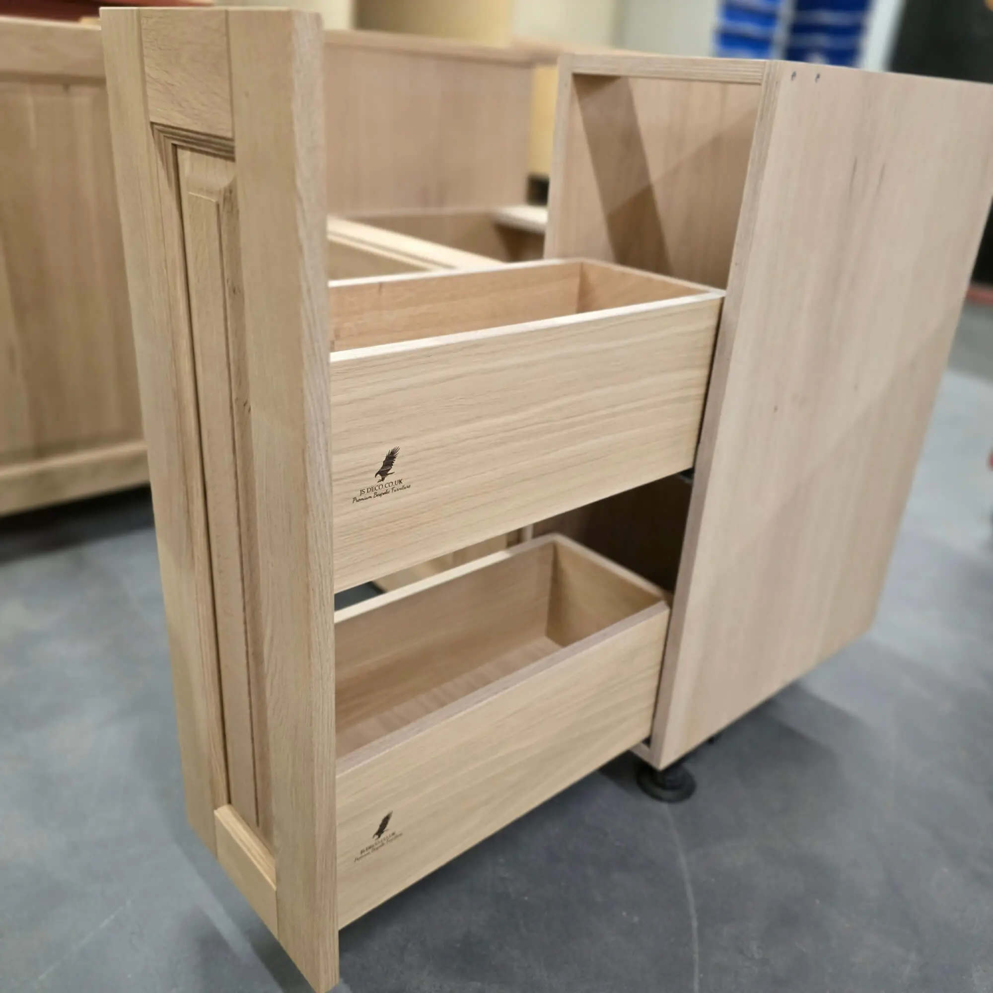 Traditional dovetail drawer joints in hand made solid oak kitchen showing craftsmanship detail