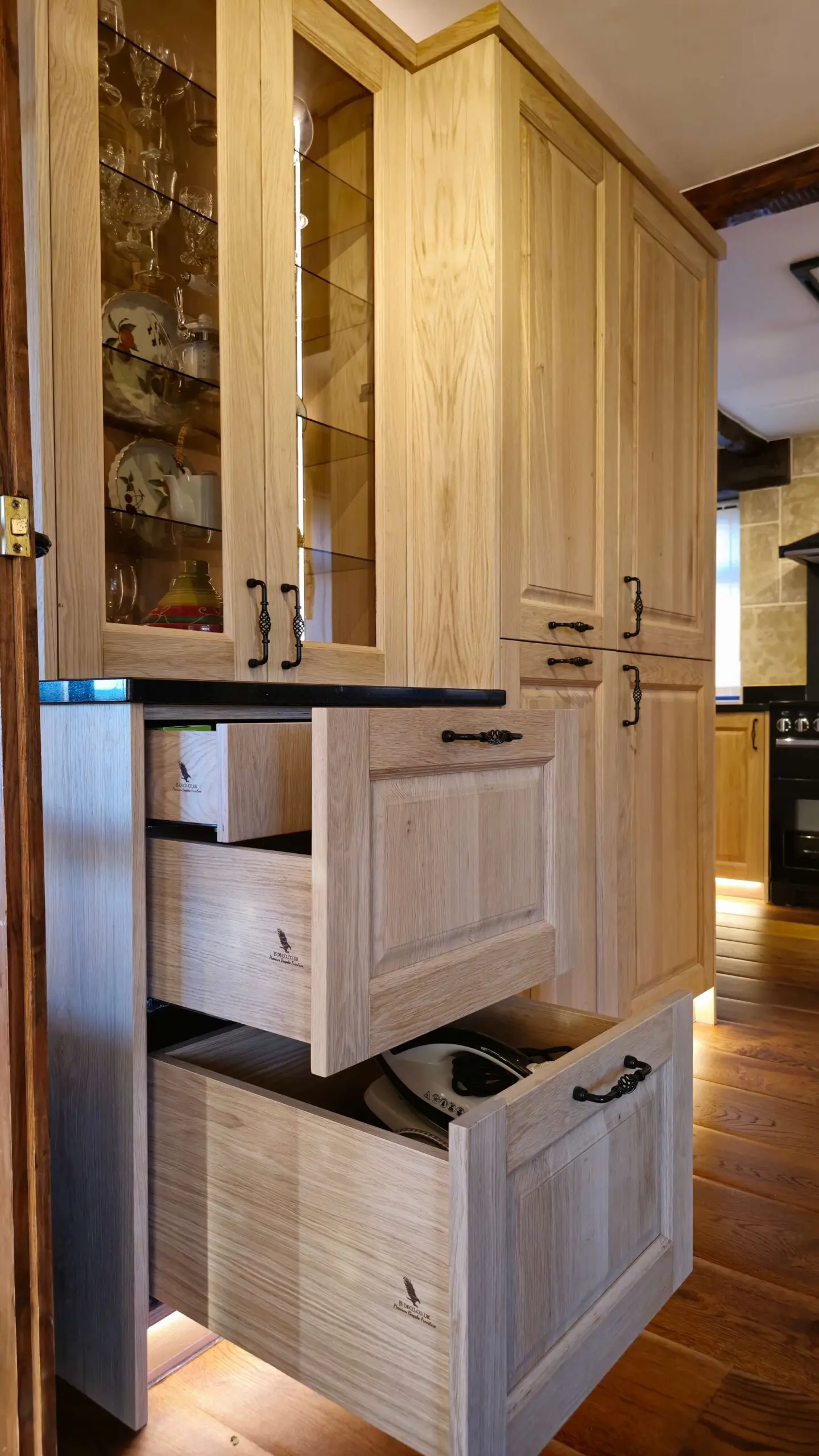 Hand made solid oak kitchen tall units with pull-out storage and glass display cabinets Huddersfield