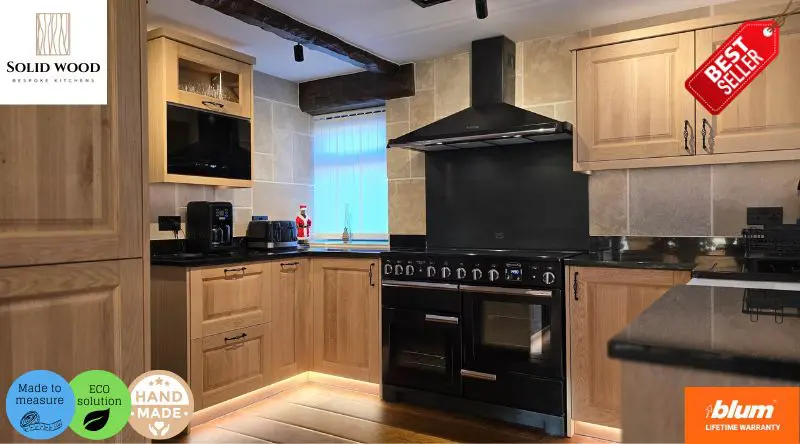 Bespoke solid wood kitchen by JS DECO, handcrafted from oak with Blum hardware, black range cooker, and traditional design finished in satin lacquer.