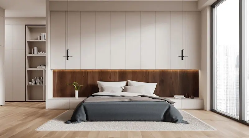 Modern bespoke fitted bedroom with built-in wardrobes and headboard, handcrafted by JS DECO.