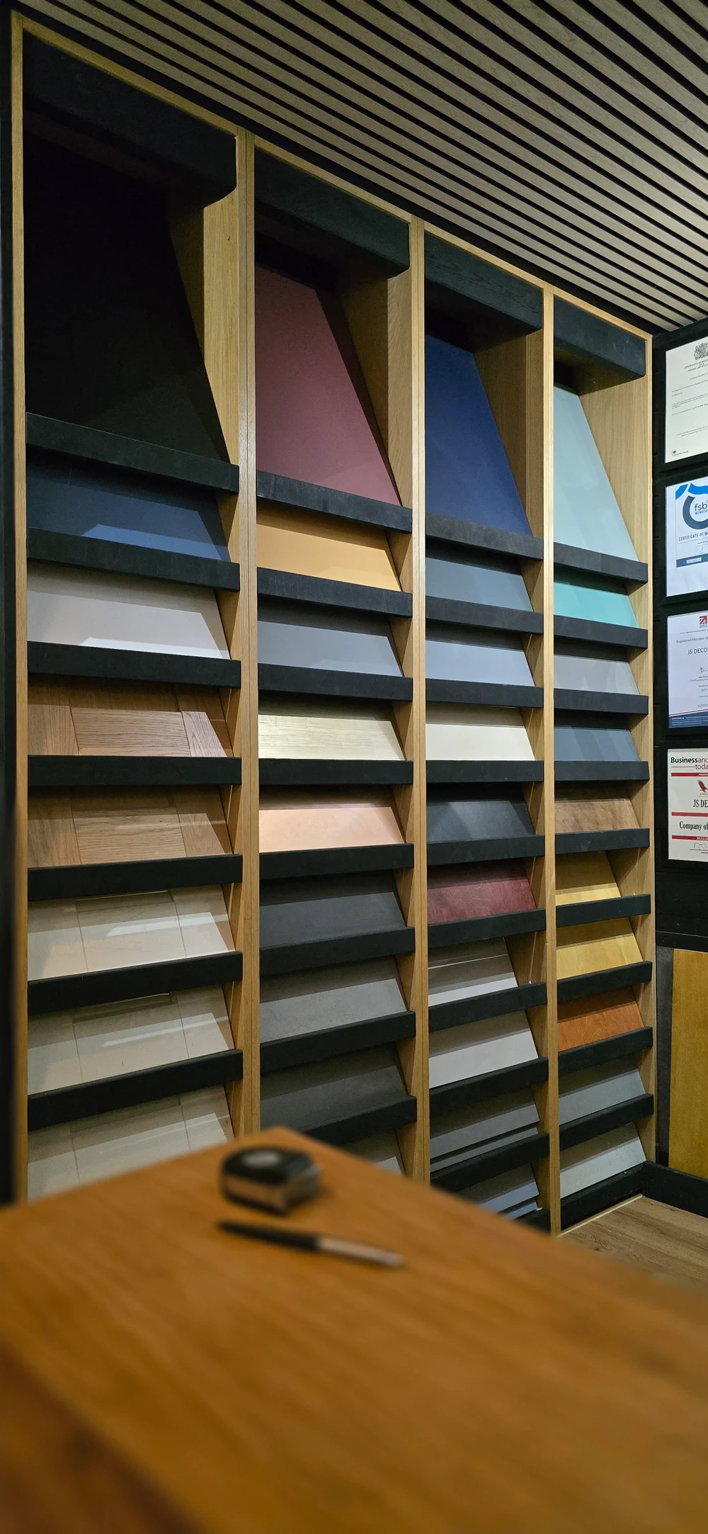 Colour, wood and surface samples displayed in the JS DECO workshop