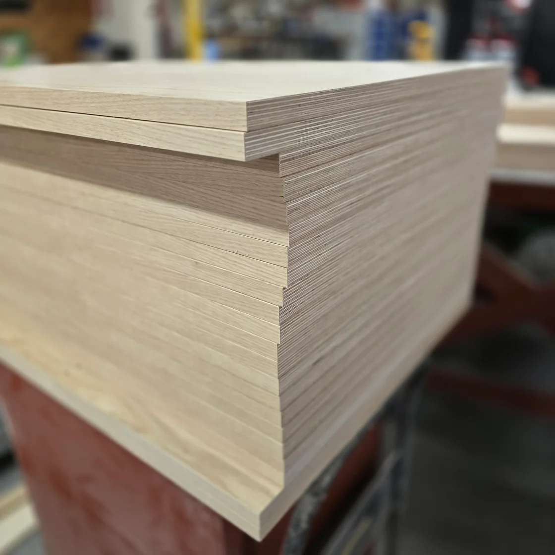 Stacked plywood panels showing the layered edges and wood-grain faces.