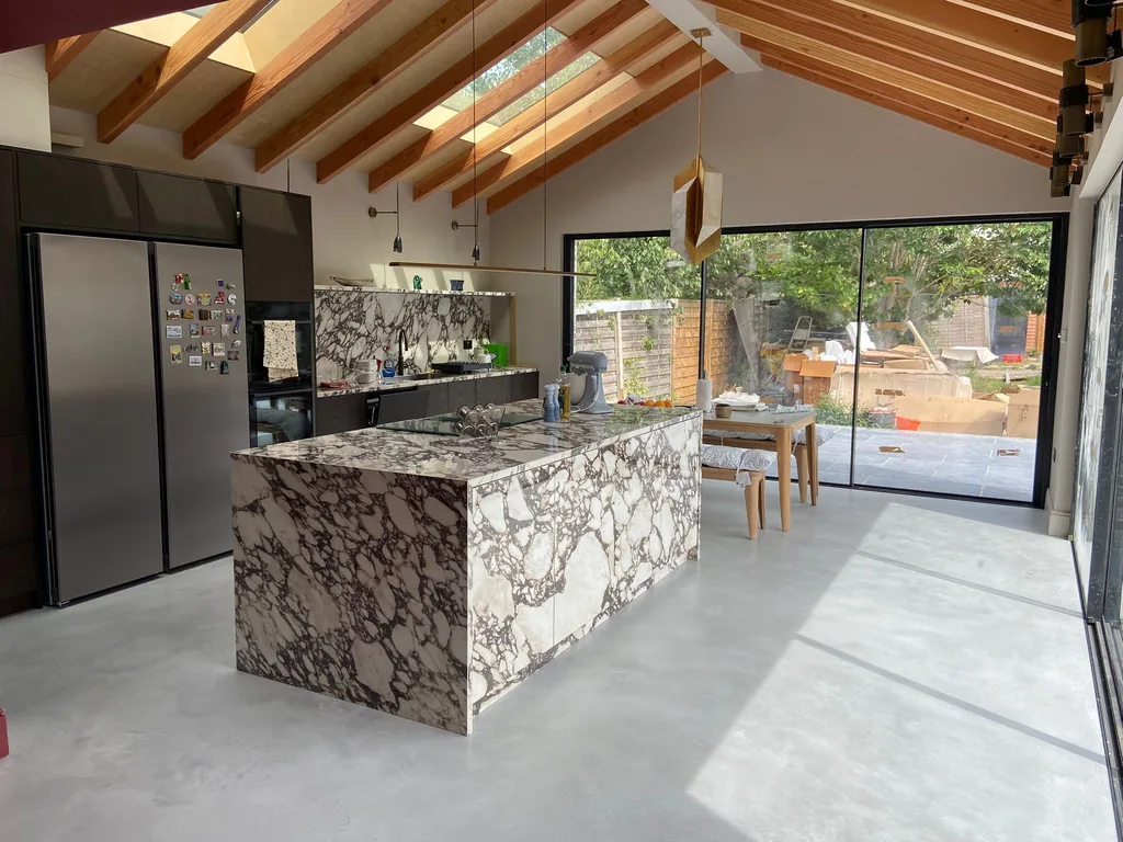 Dark-stained bespoke kitchen with XTone ceramic island in a contemporary extension