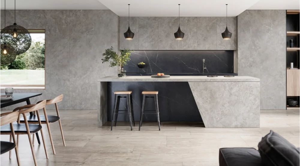 XTONE ceramic kitchen with pale stone-effect cabinetry and a contrasting dark island detail.