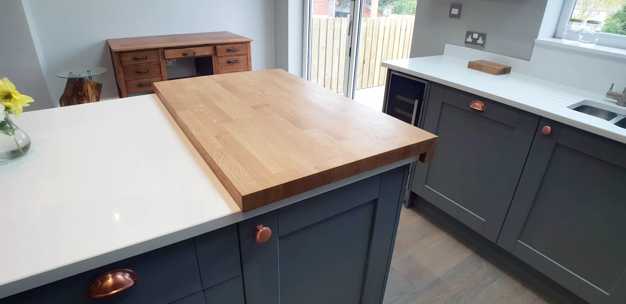 Dust grey bespoke shaker style kitchen quartz worktop with oak chopping board