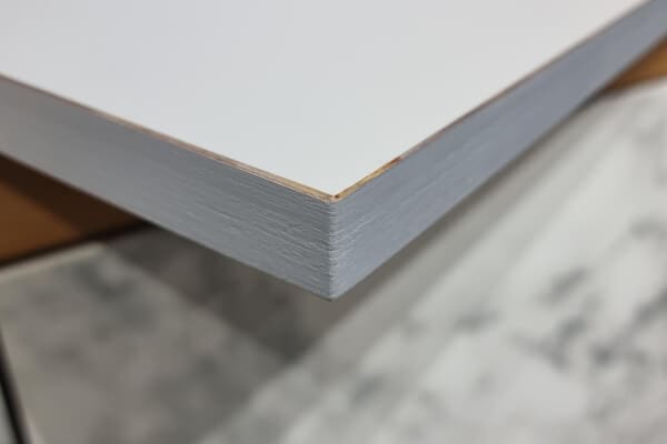 FENIX NTM plywood-core door panel with painted edge and white ultra-matt surface.