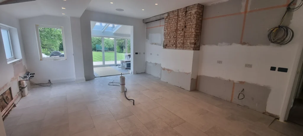 Before kitchen installation: the chimney breast and service positions within the renovation.