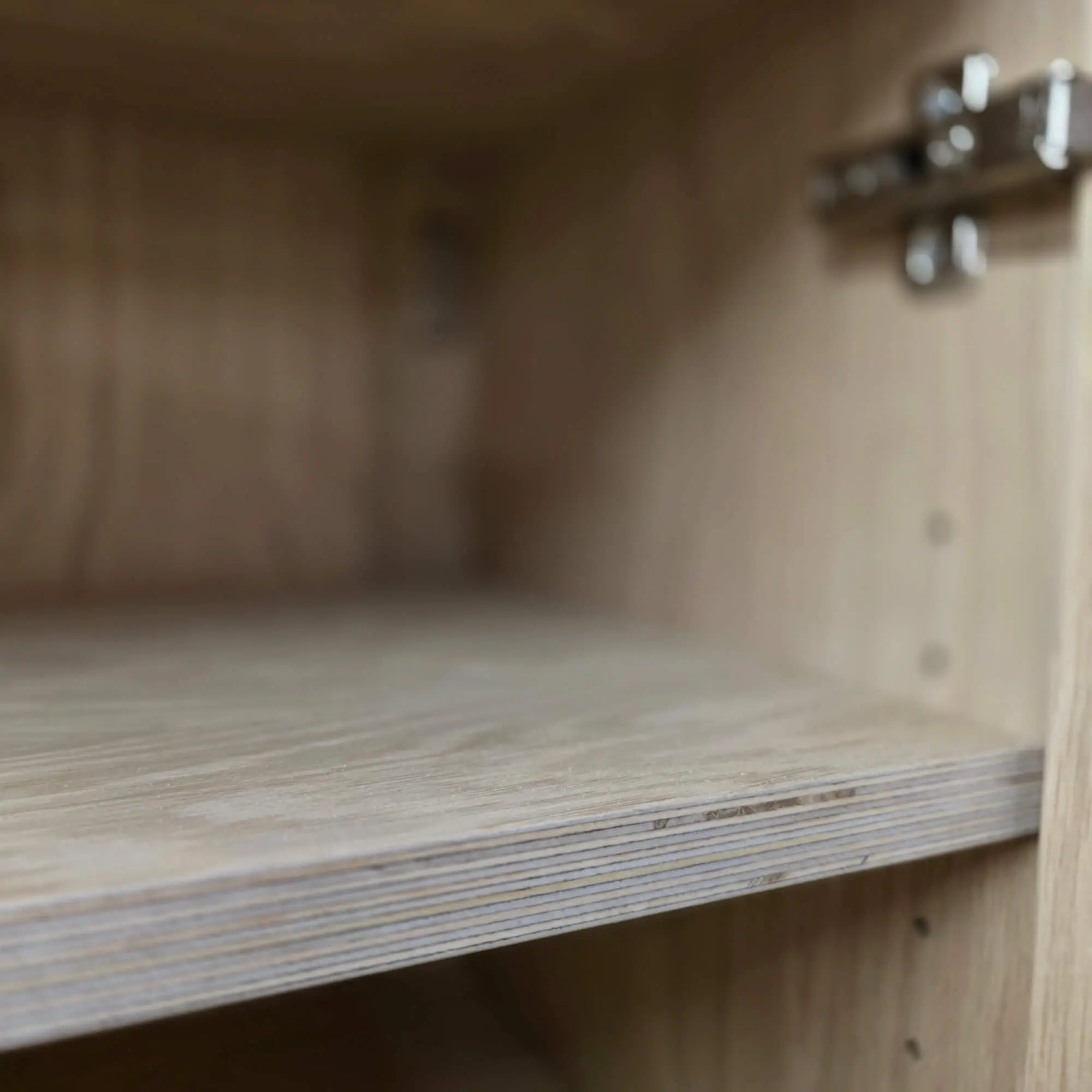 Interior detail of an oak-veneered plywood cabinet shelf for a bespoke plywood kitchen in London by JS DECO.