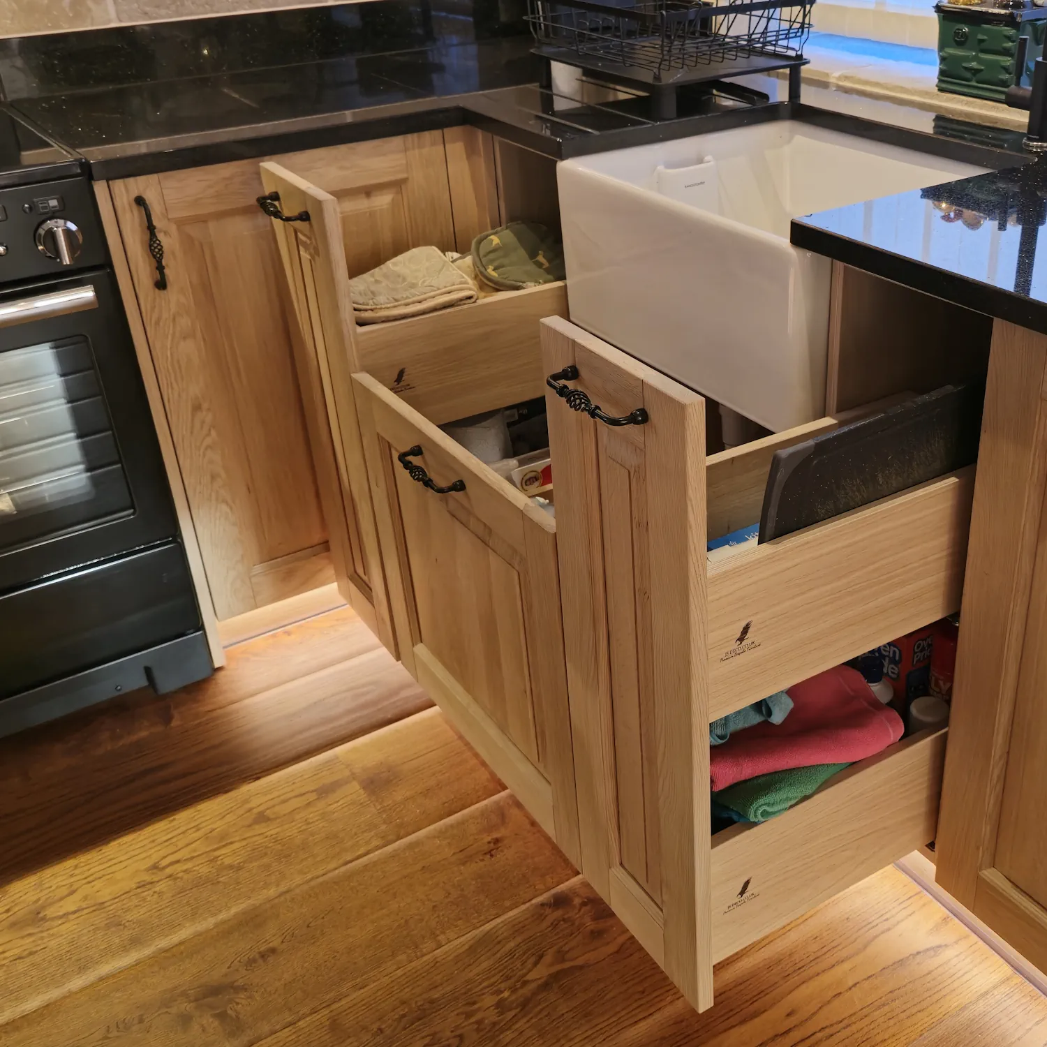 Image showing pull out cabinets and drawers around belfast sink