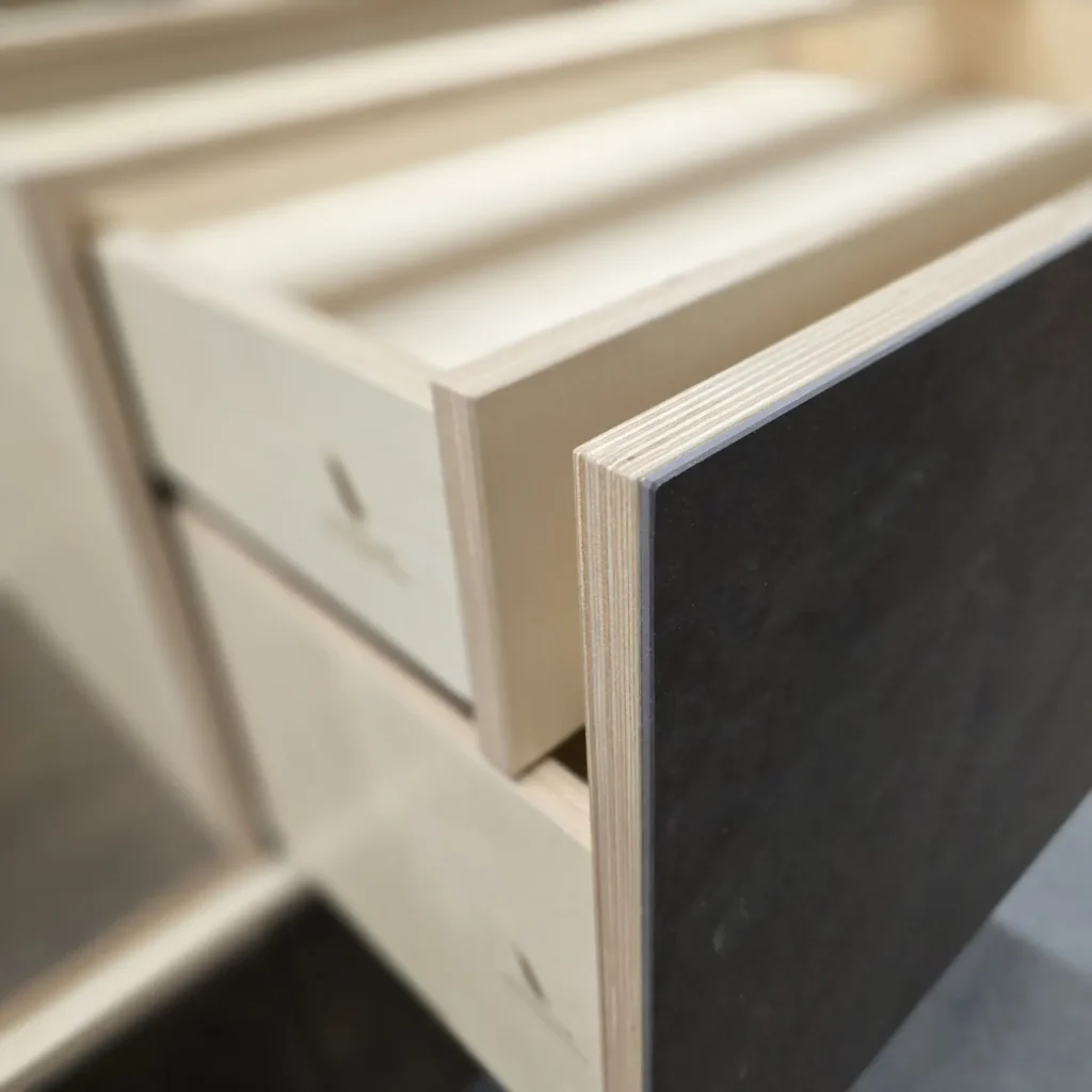 Bespoke plywood kitchen with ceramic finish Ceramic kitchen surface with visible birch plywood core showing the construction beneath the finish