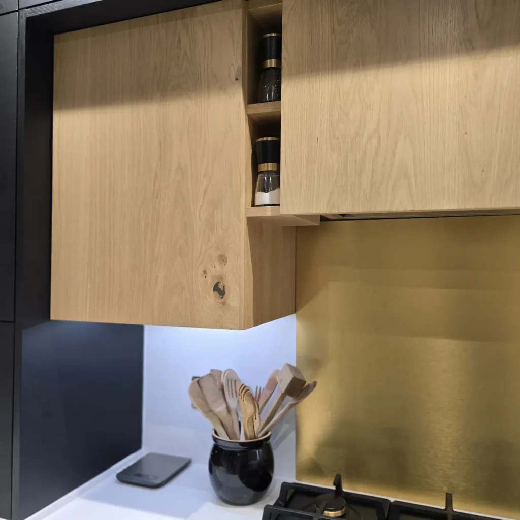 Natural oak veneered wall cabinets in kitchen