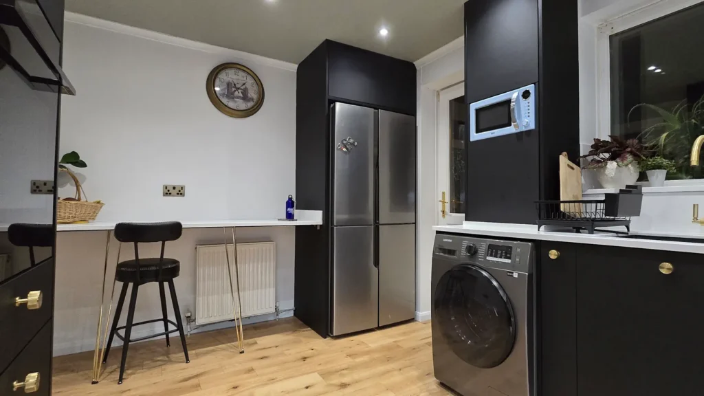 FENIX NTM Nero Ingo kitchen with bespoke tall units and integrated appliances