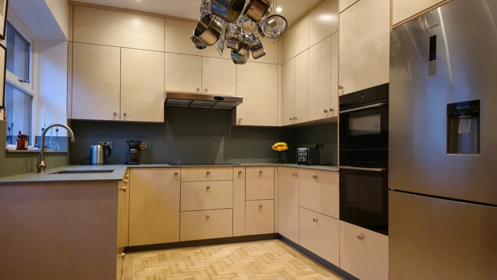 Wide view of premium bespoke plywood kitchen with green FENIX worktops in Matlock Derbyshire renovation