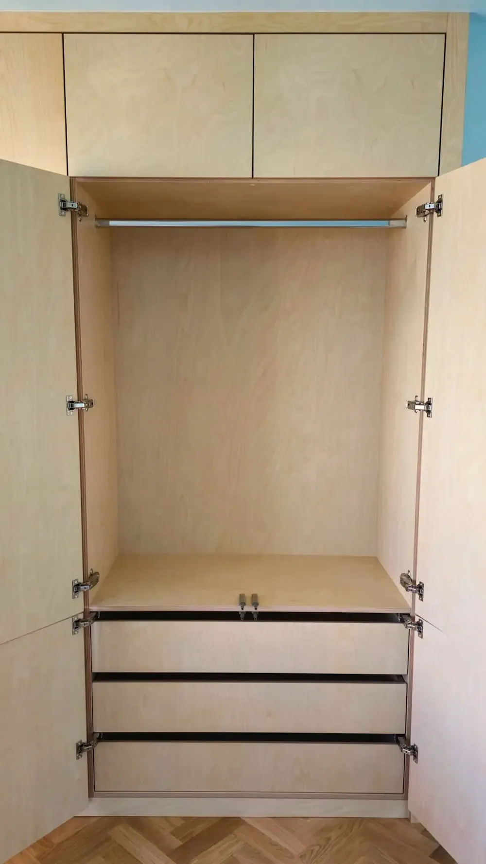 Internall drawers in bespoke birch plywood wardrobe with hanging rail