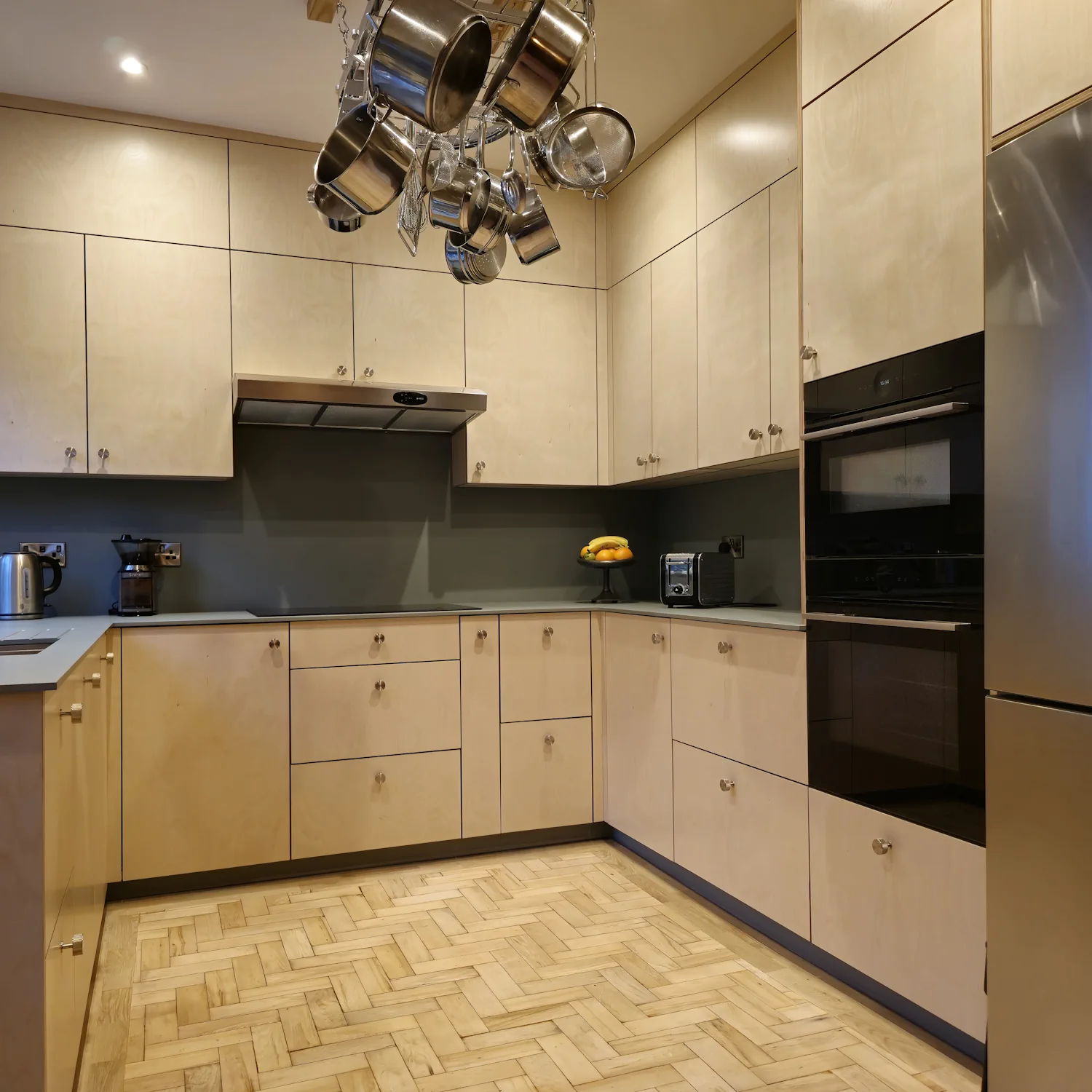Plywood kitchen with FENIX NTM Verde Brac worktop Plywood kitchen with FENIX NTM Verde Brac solid worktop and splashback in contemporary Matlock Derbyshire kitchen
