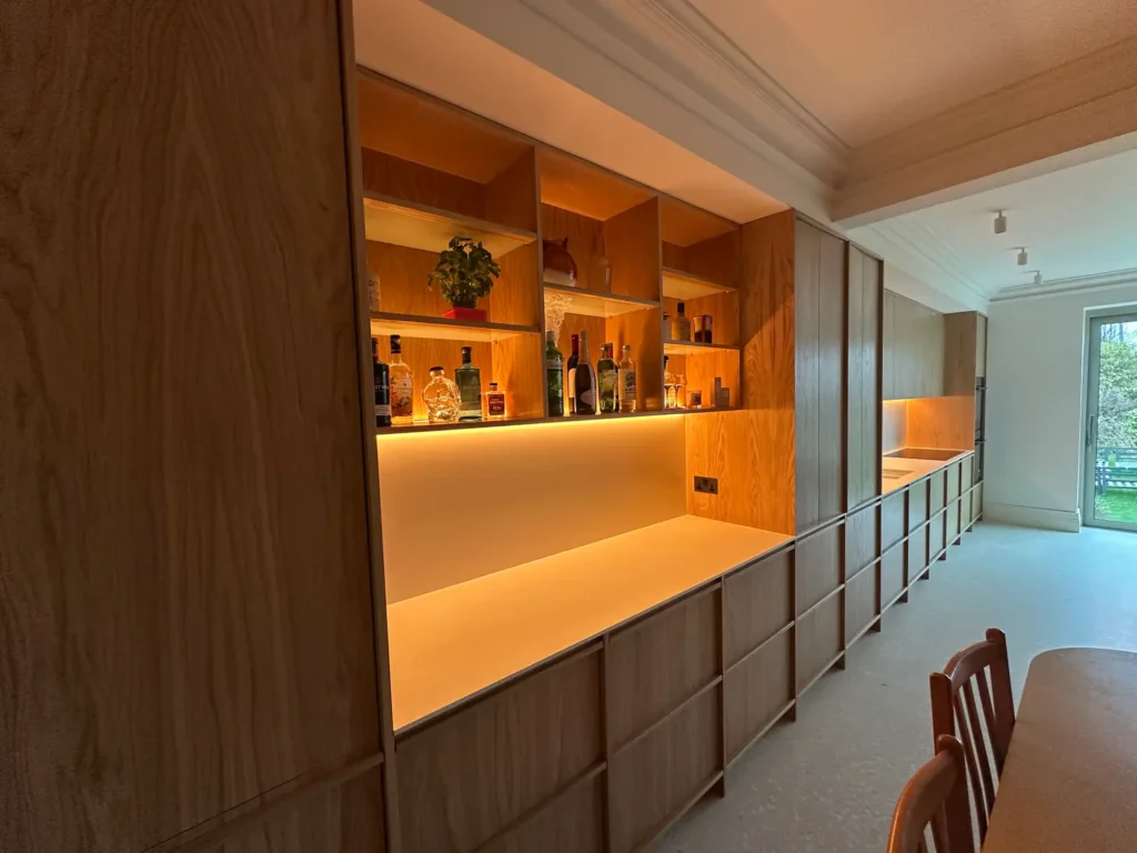 The completed working run with integrated lighting beneath the wall cupboards.