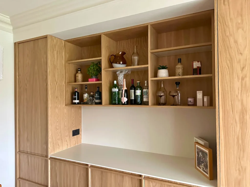 Tall oak cabinetry and the alignment of the neighbouring fronts.