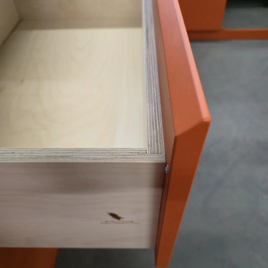 Workshop detail of a plywood drawer box and painted front, before the cabinetry was installed.