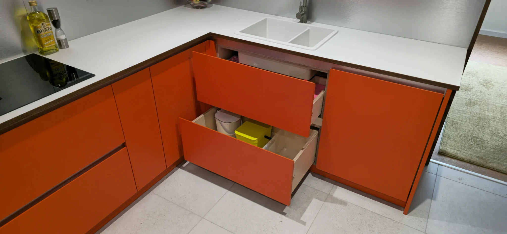 The open sink drawers show the divided upper storage and full lower drawer.